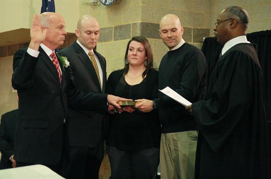 Freeholder Gary J. Rich Sr. of Spring Lake, with his three children at his side, takes oath of office from Superior Court Assignment Judge Lawrence M. Lawson. Freeholder Gary J. Rich Sr. of Spring Lake, with his three children at his side, takes oath of office from Superior Court Assignment Judge Lawrence M. Lawson.